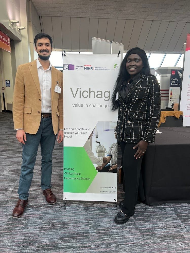 Shashank and Beatrice at the Vichag stand, WMHTIA International Assembly 2025